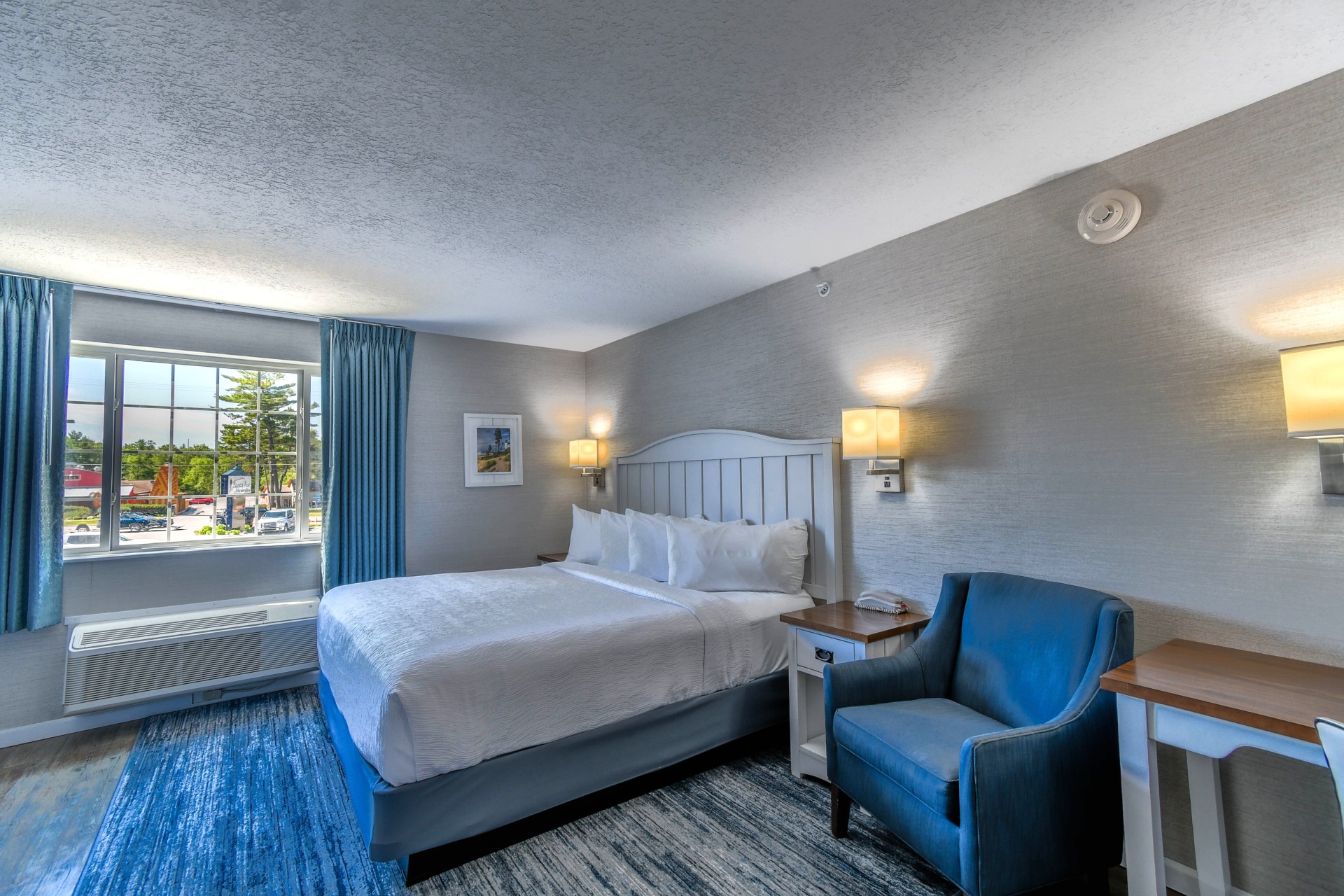 a room with a bed and a chair