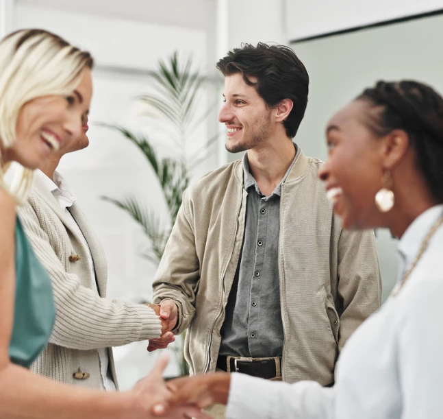 a group of people shaking hands
