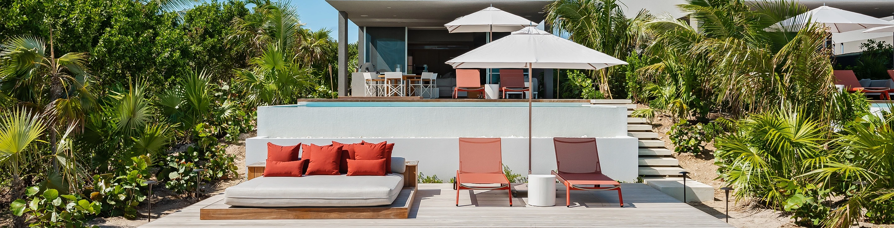 a patio with chairs and umbrellas