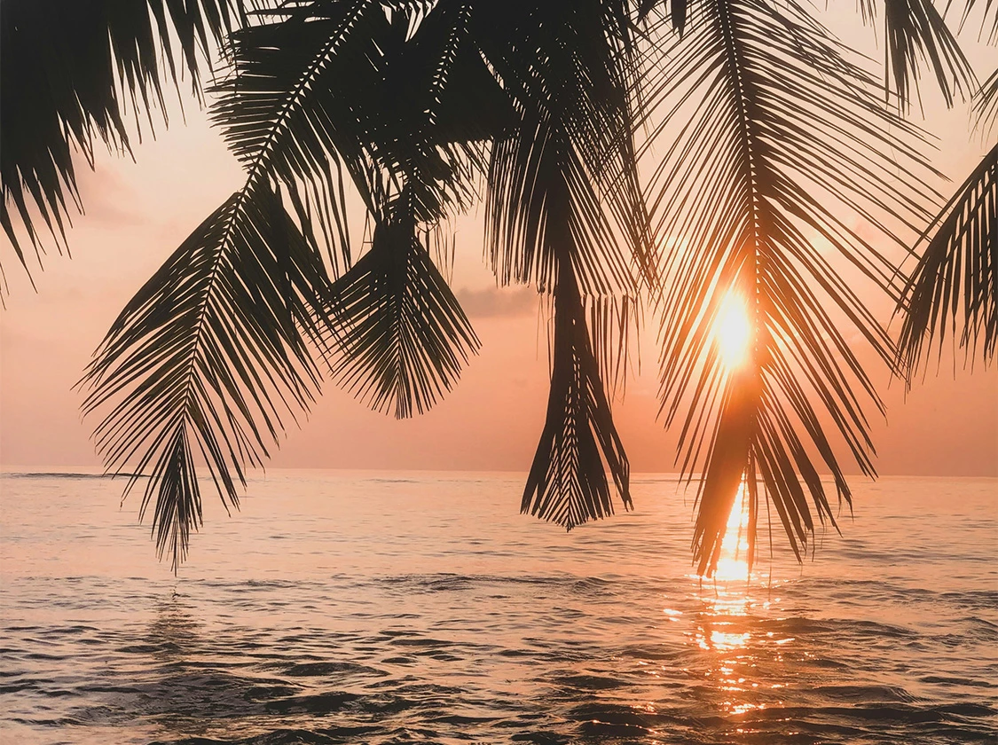 a sunset over a body of water