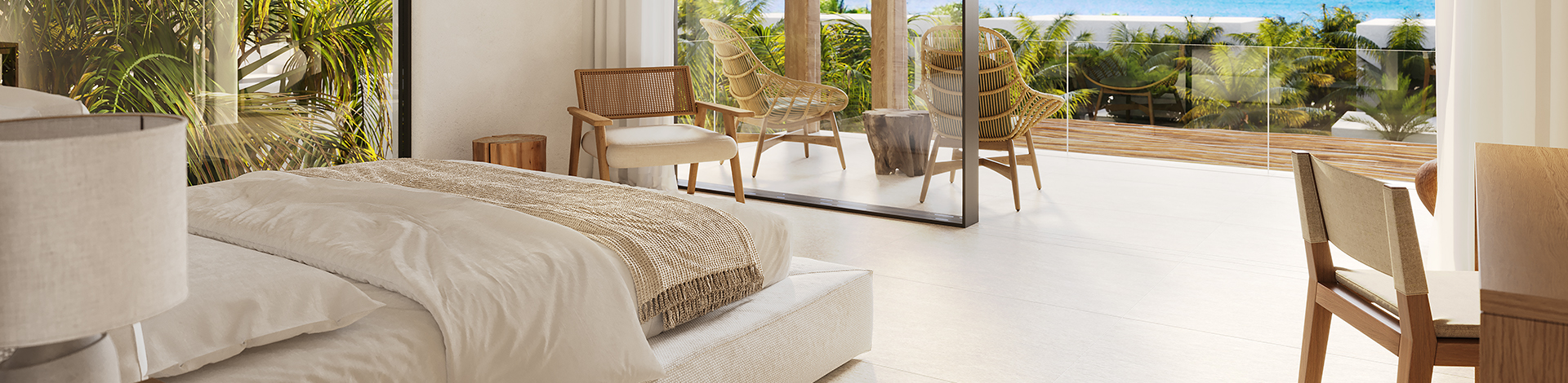 a room with a bed and chairs