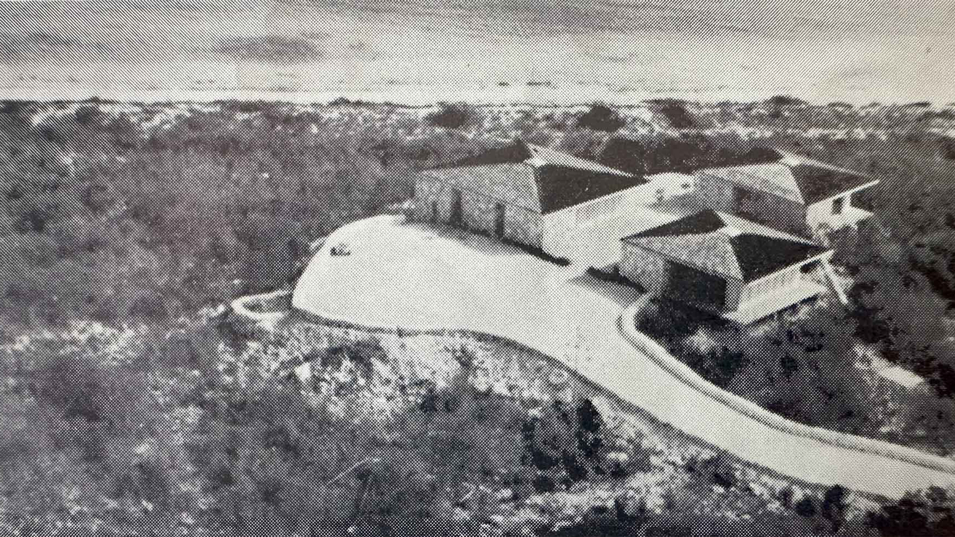 a black and white photo of a house