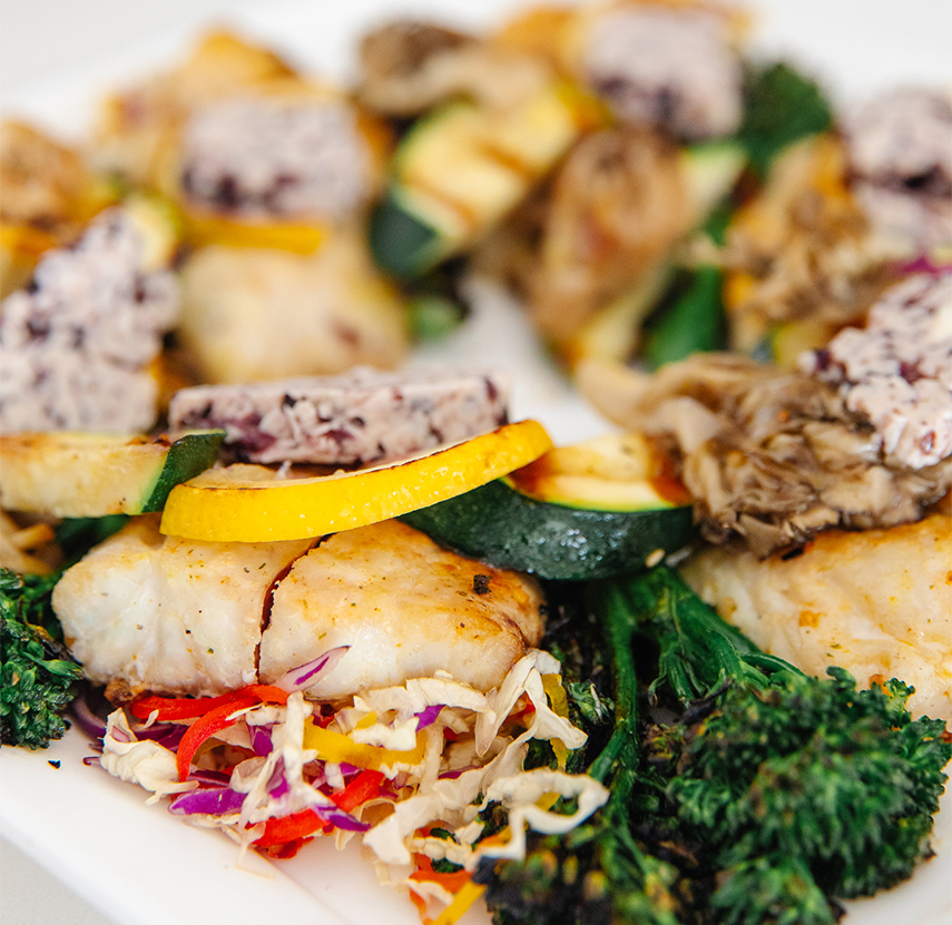 a plate of food on a white surface