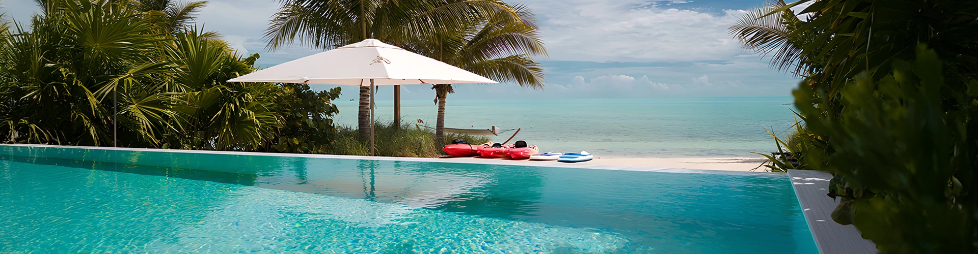 a pool with a white umbrella and red rafts on it
