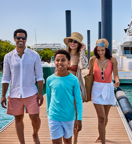 a group of people walking on a dock