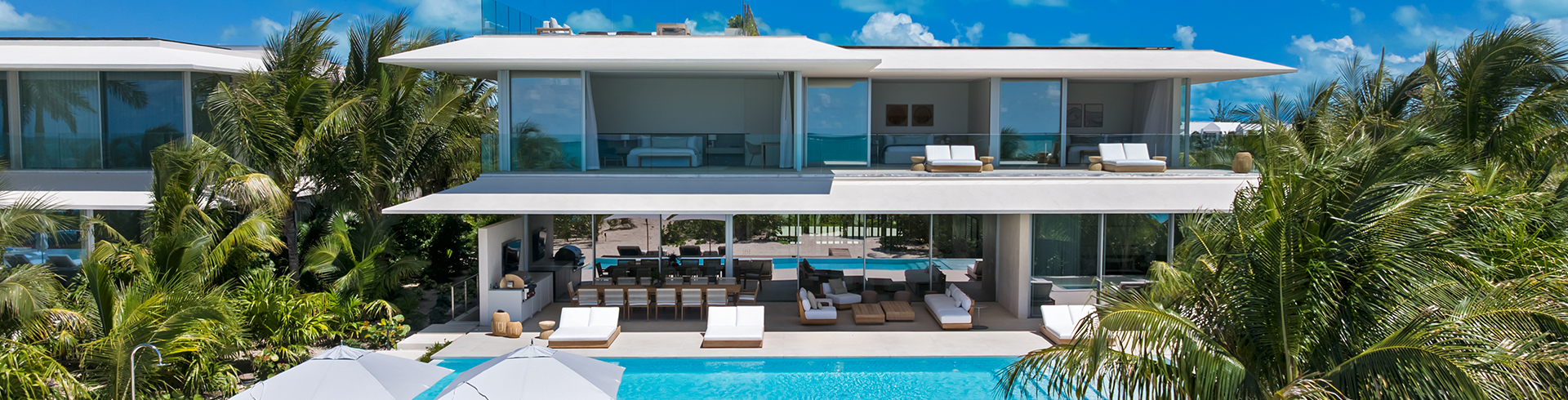 a pool with chairs and a deck chair