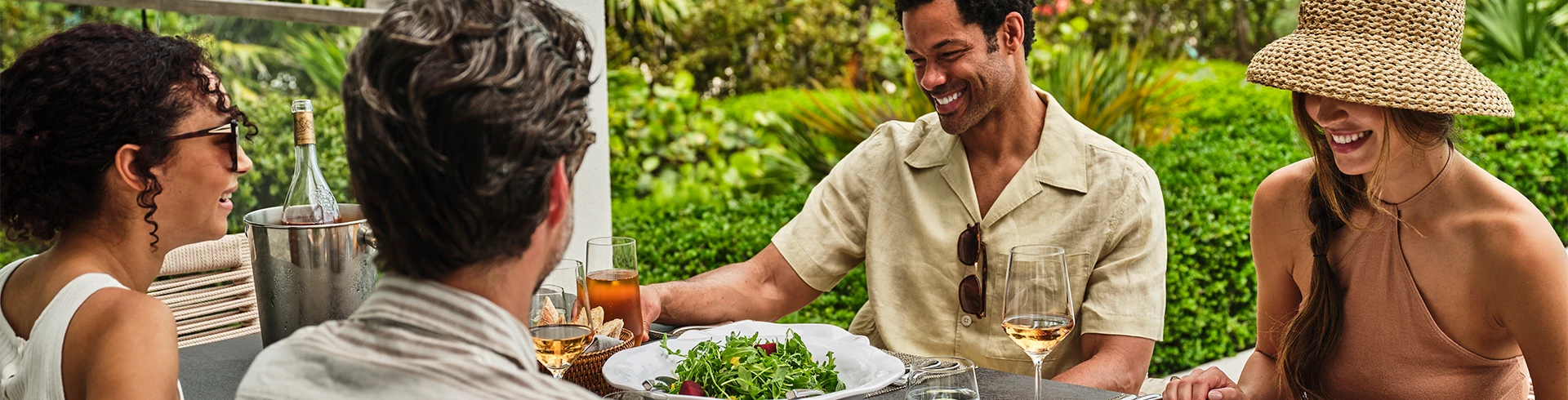 a man smiling at a plate of food