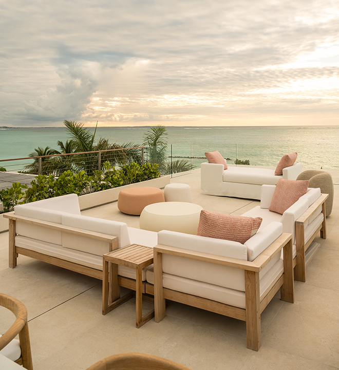a patio with a view of the ocean