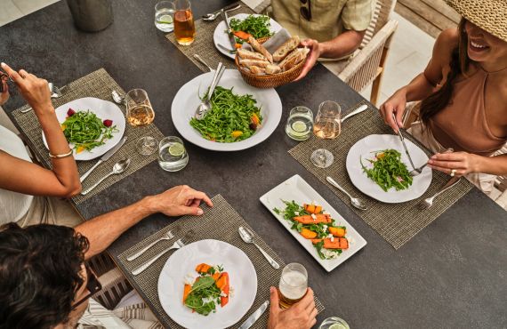 a group of people eating at a table