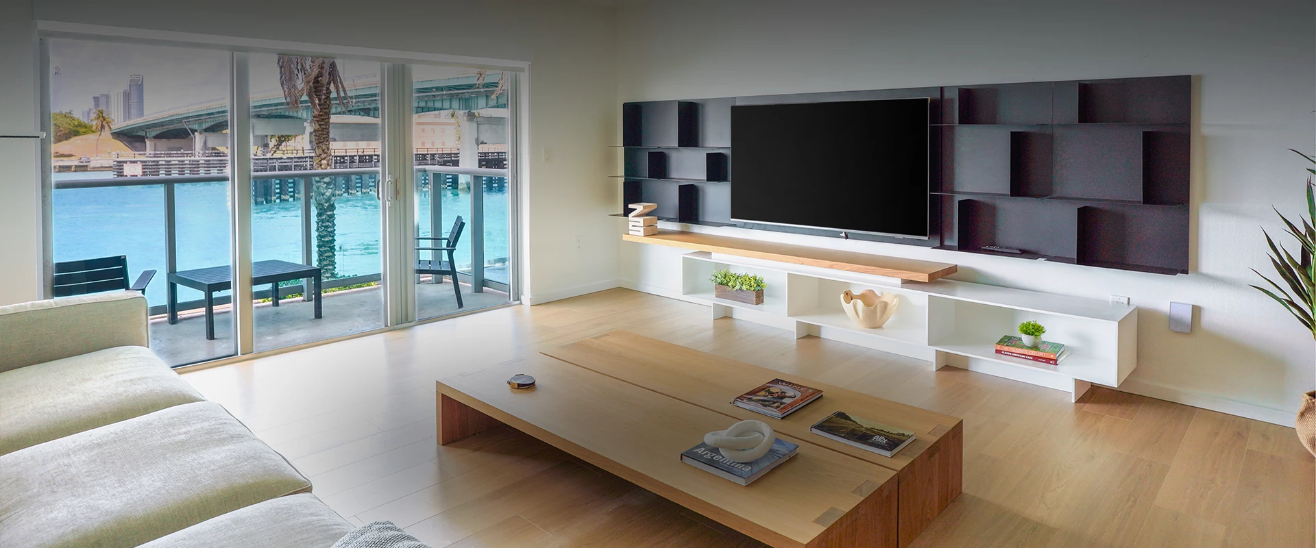 a living room with a television on the wall