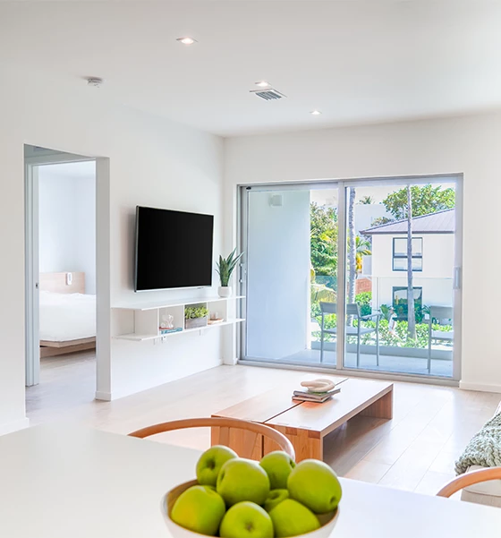 a room with a table and a television