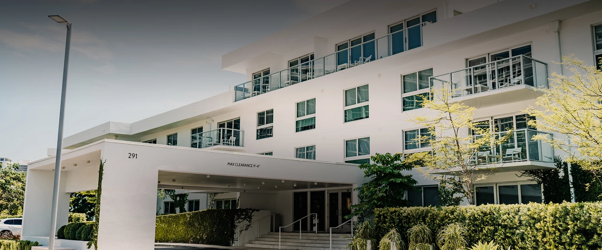 a white building with a balcony
