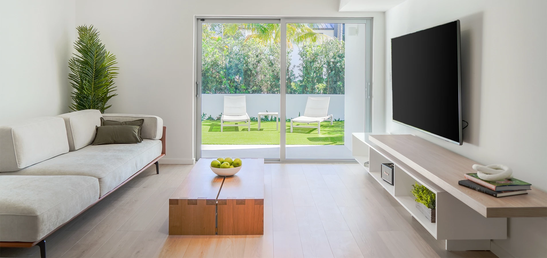 a living room with a television and a table