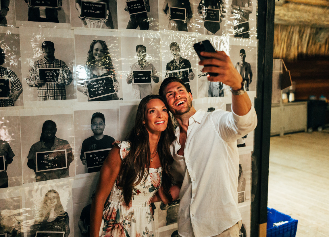 a man and woman taking a selfie