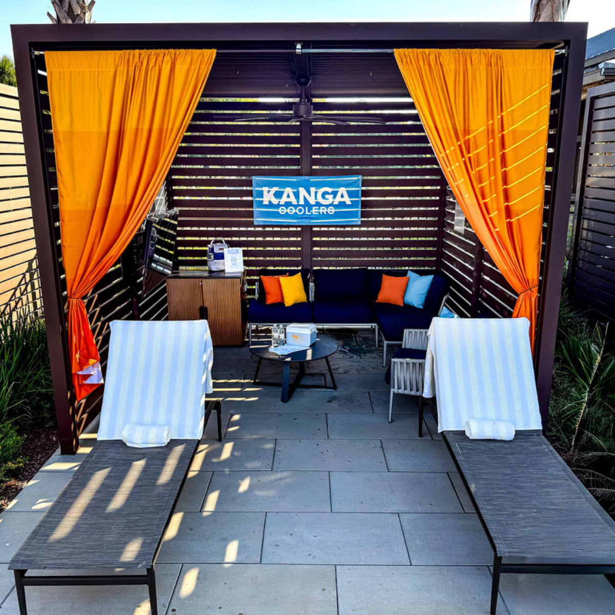 a patio with chairs and a table