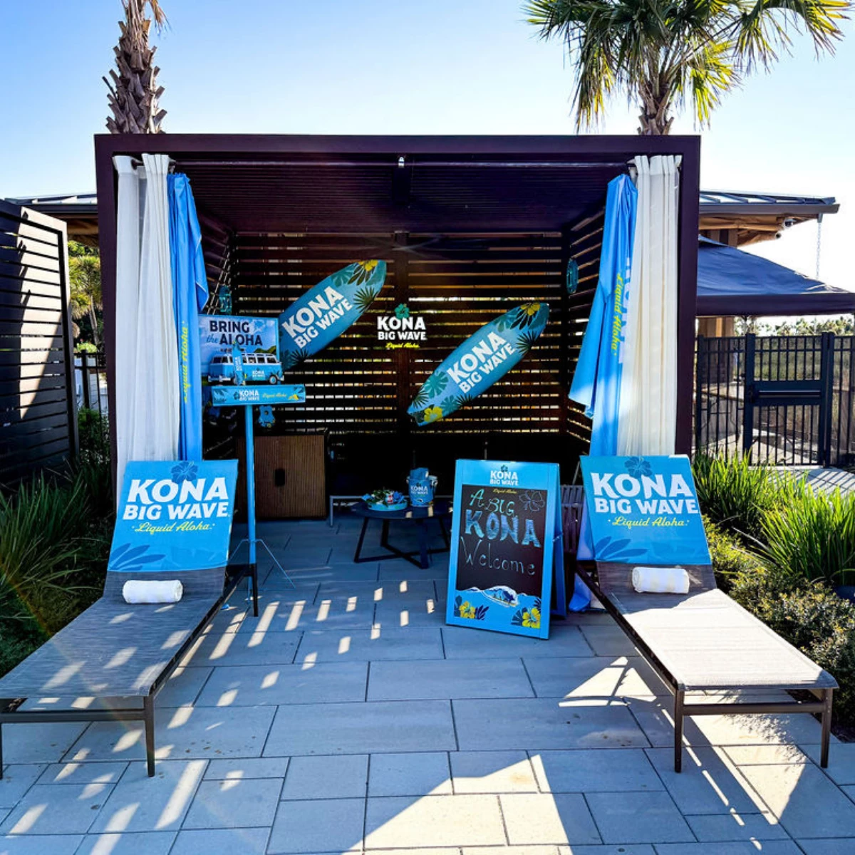 a tent with blue signs and umbrellas