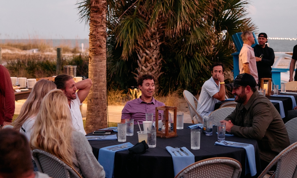 a group of people sitting around a table