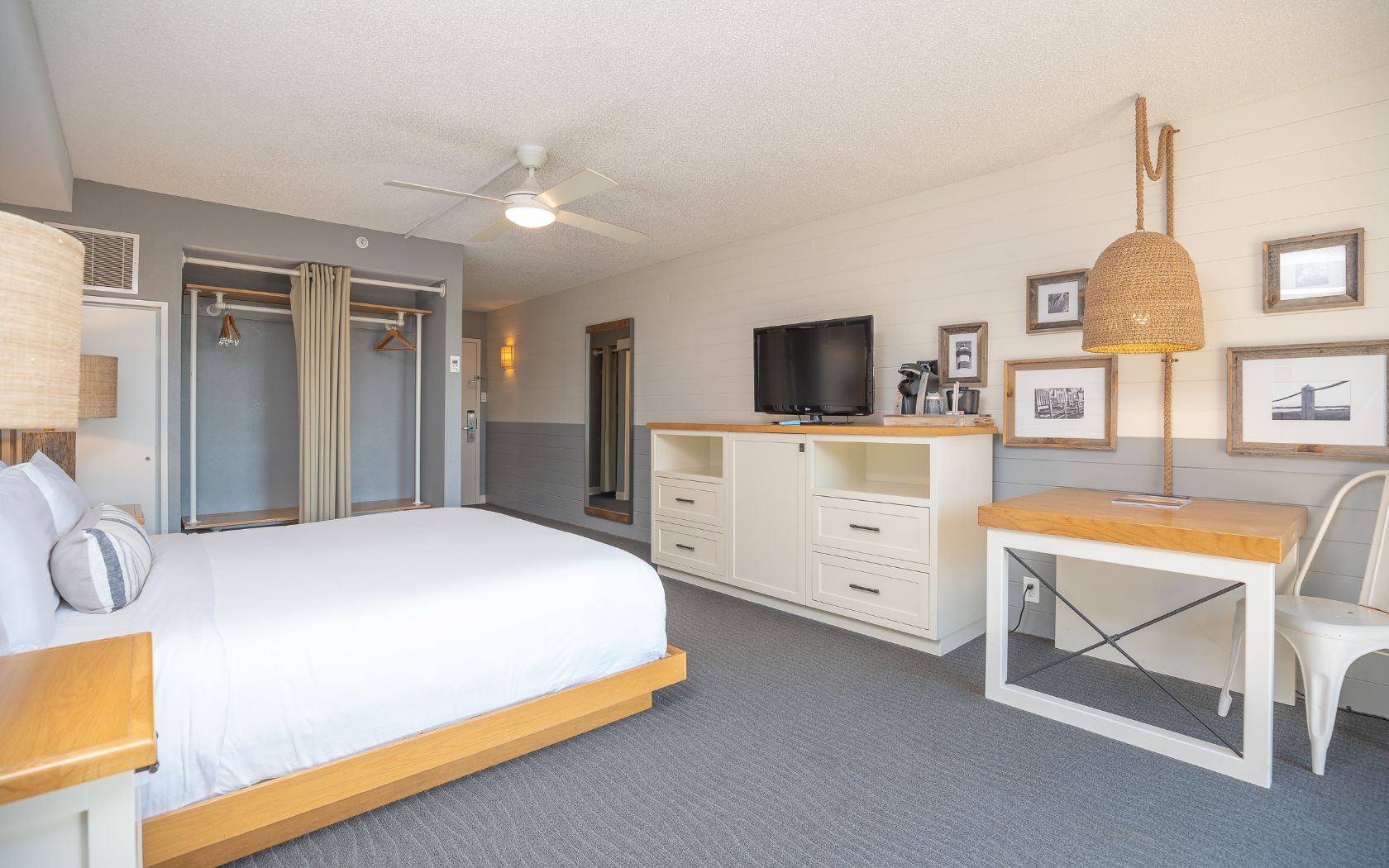 a room with a bed and a tv
