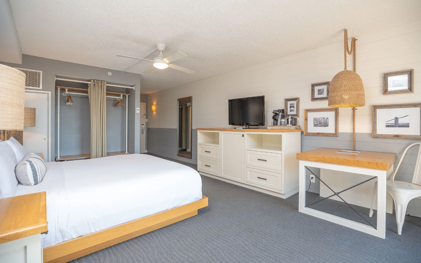 a room with a bed and a tv