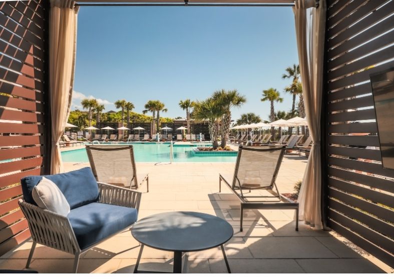 a pool with chairs and a table