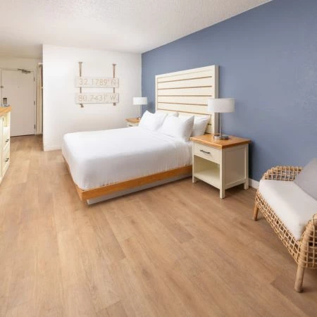 a room with a bed and a chair