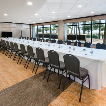 a long conference room with a long table and chairs
