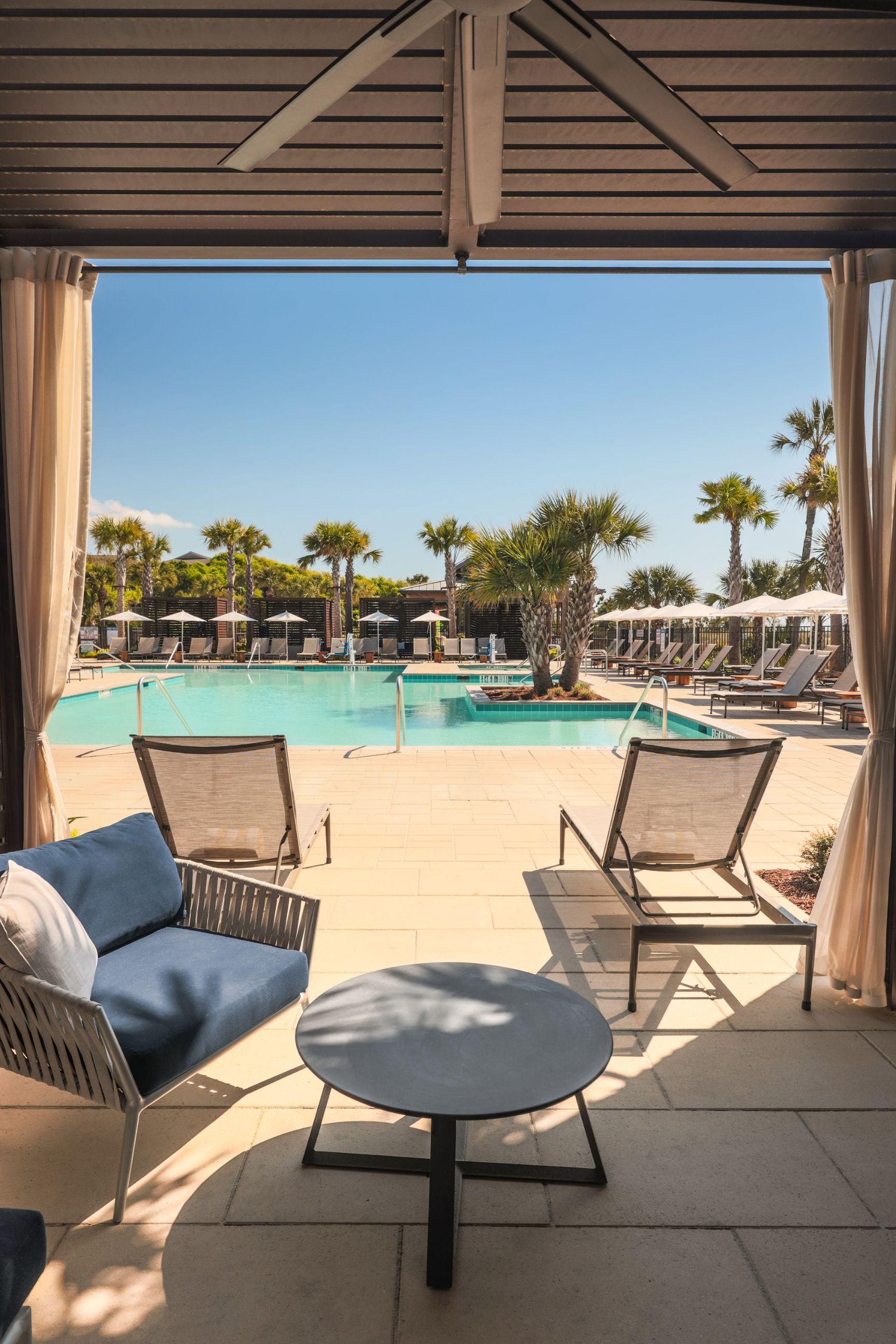 a pool with chairs and a table