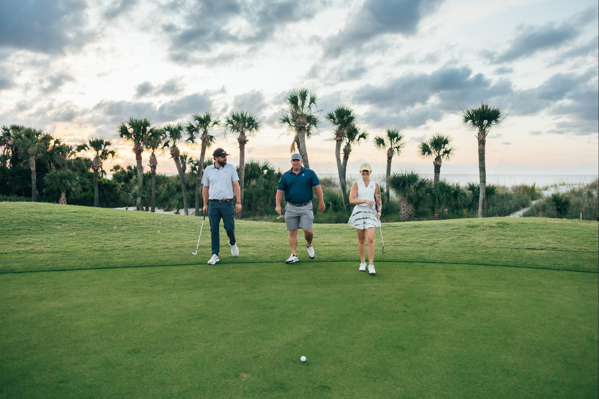a group of people on a golf course