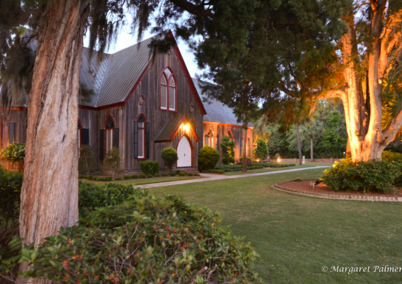 a house with a lawn and trees