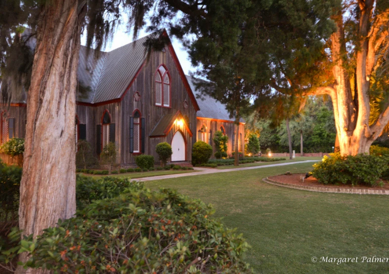 a house with a lawn and trees