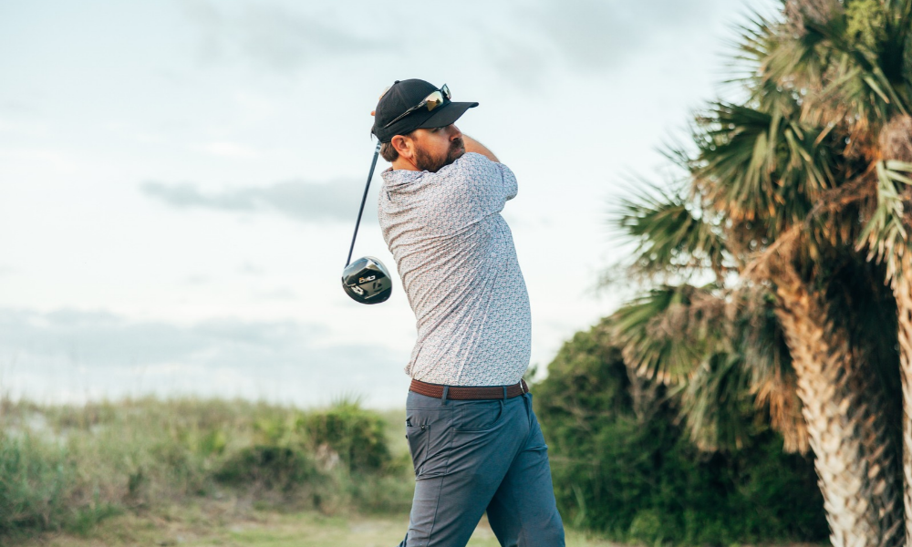 a man swinging a golf club