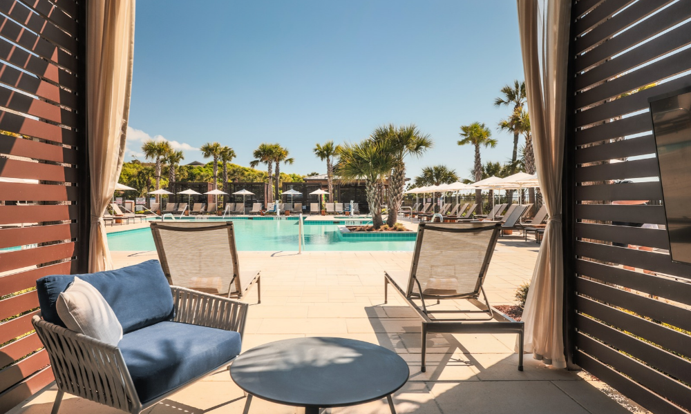 a pool with chairs and umbrellas