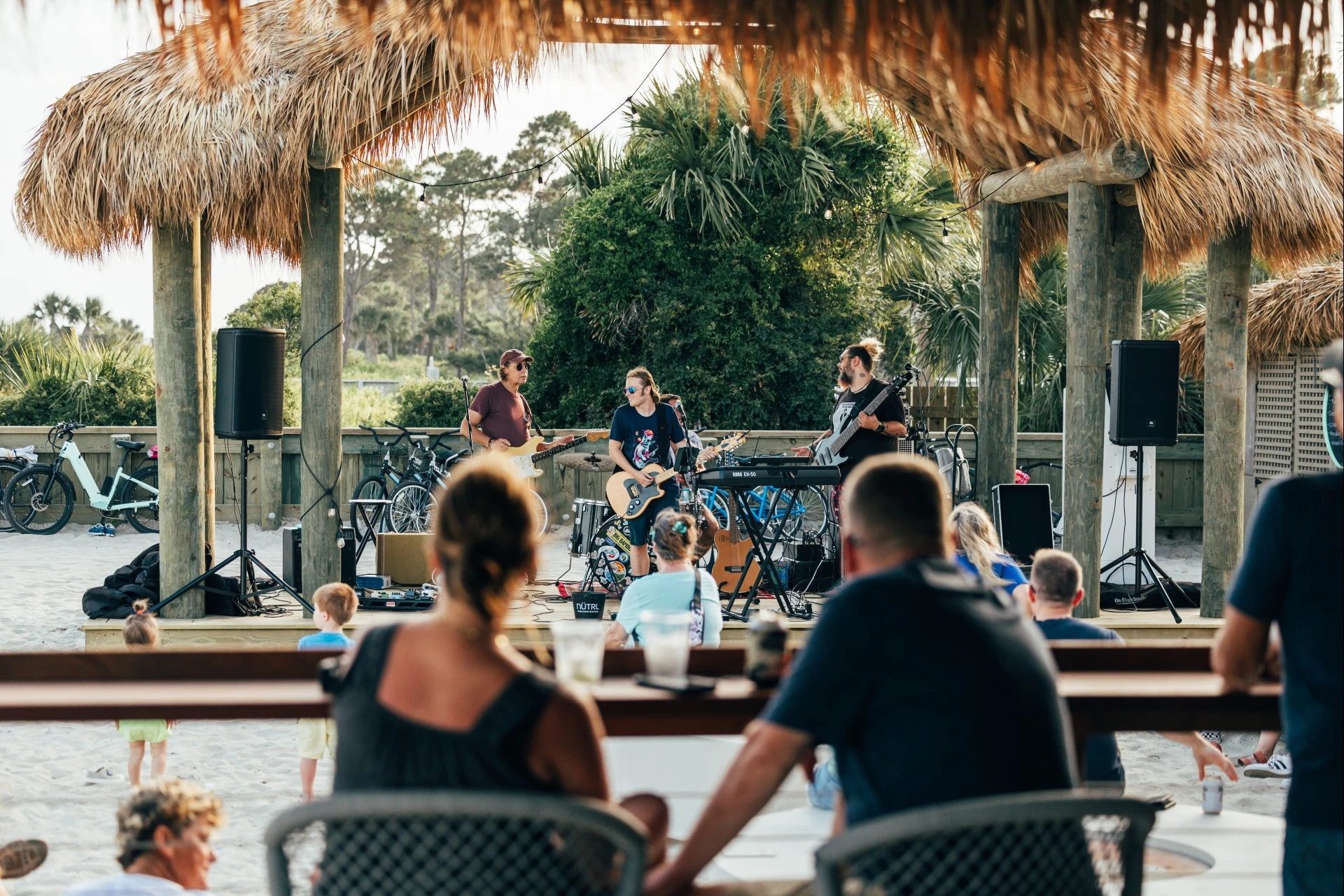 a group of people playing instruments on a stage