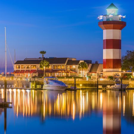 a lighthouse next to a body of water