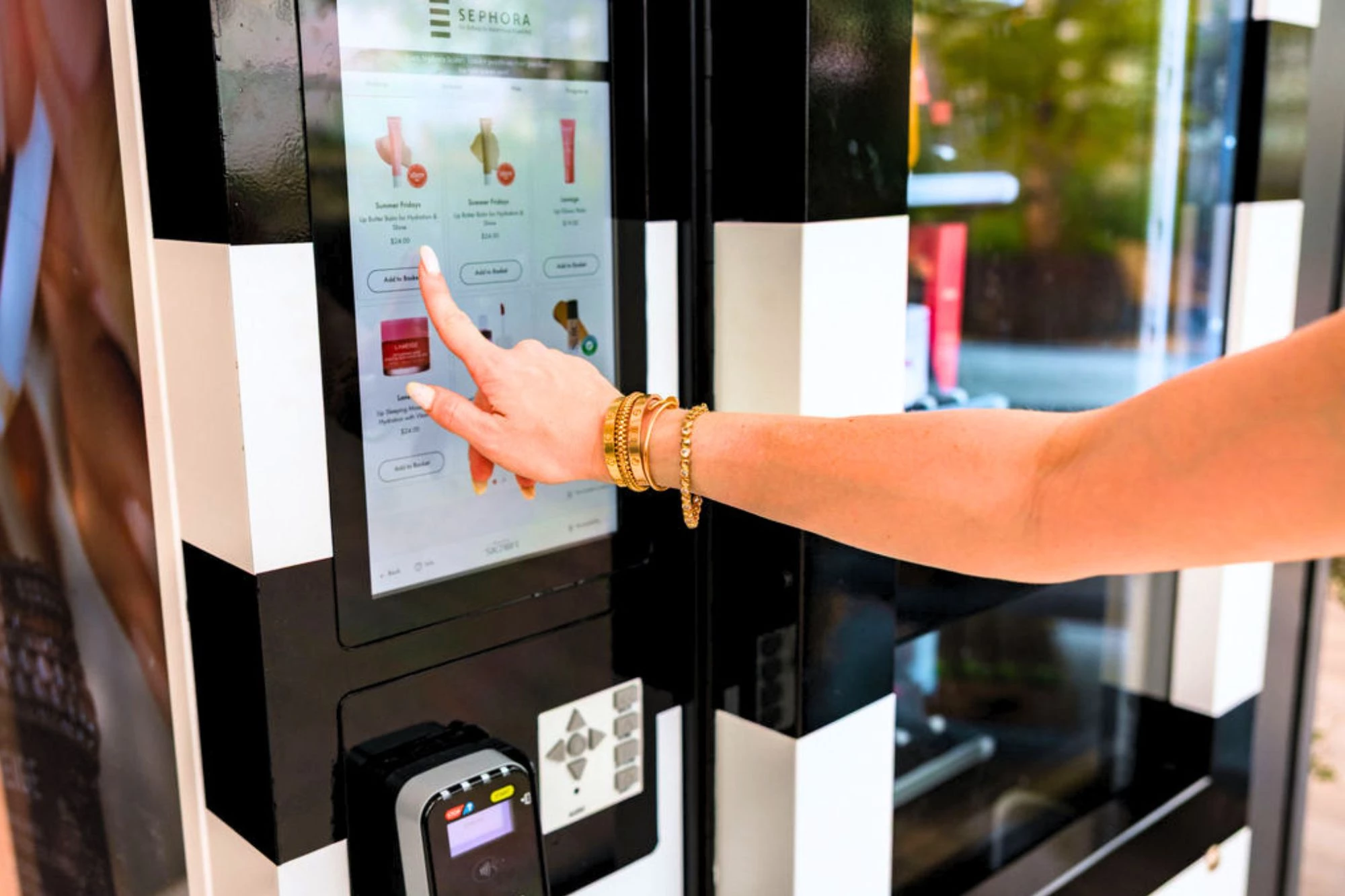  a hand touching a screen