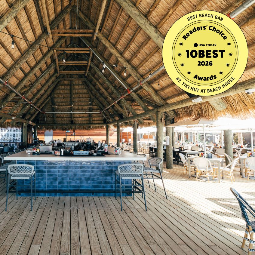 a restaurant with a thatched roof