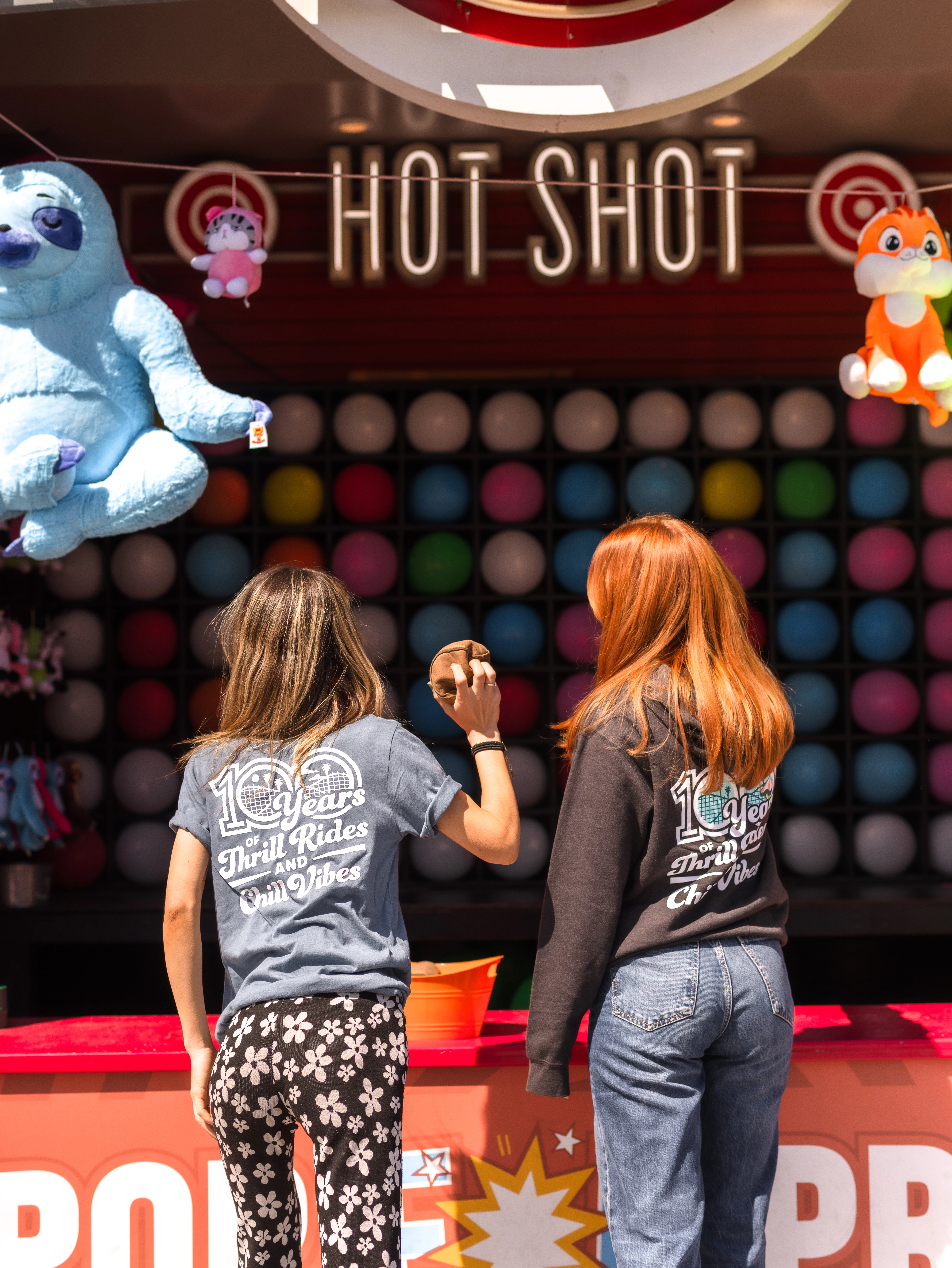 Two people playing Hot Shot game