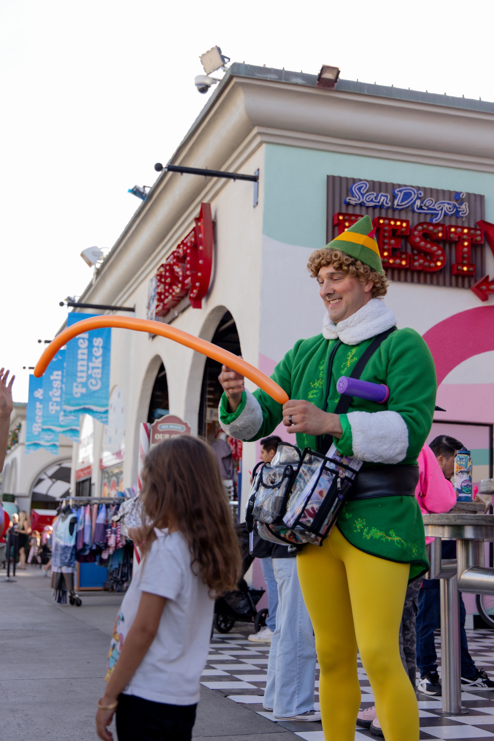 a man in a garment holding a balloon