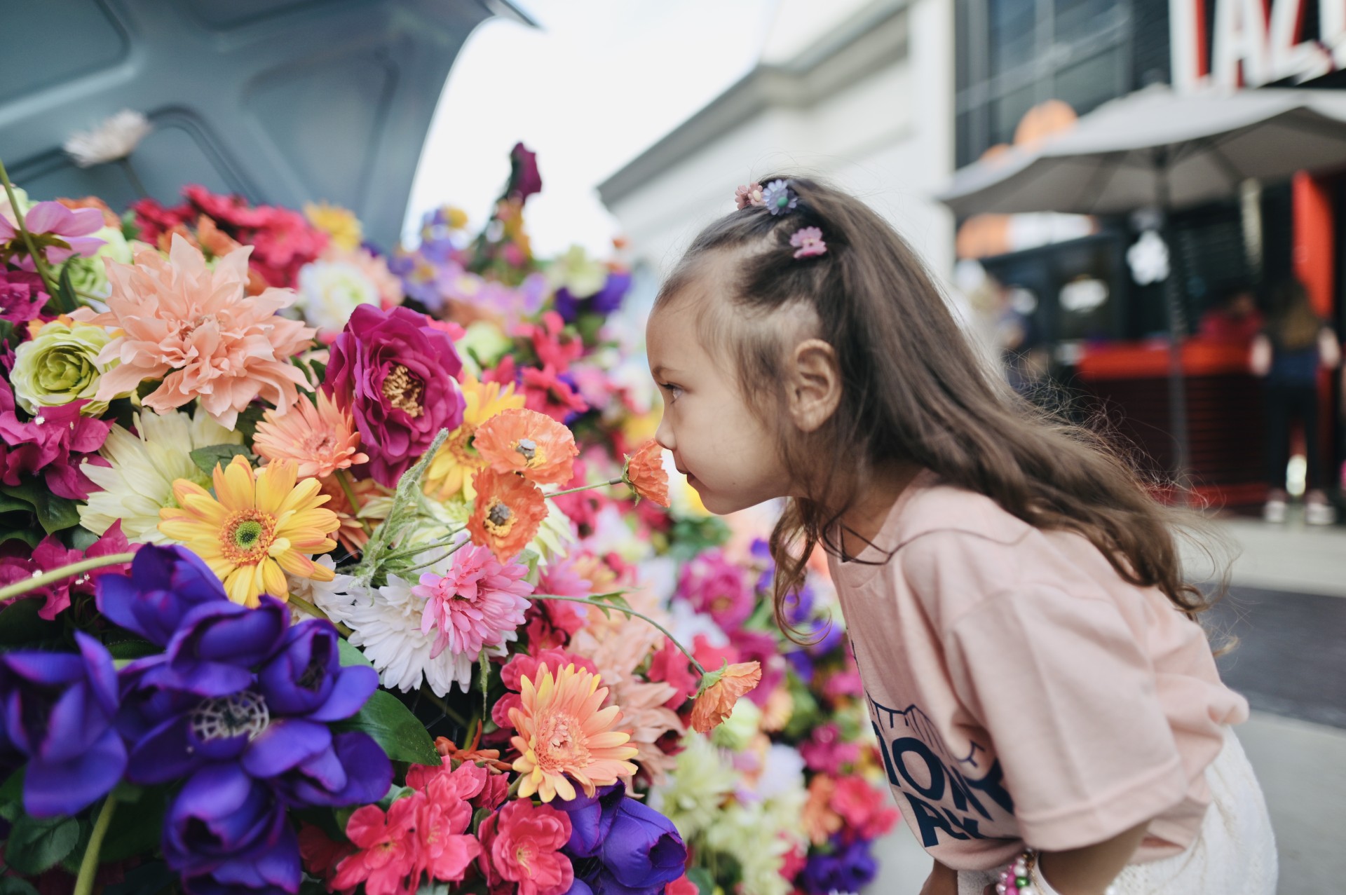a girl smelling flowers