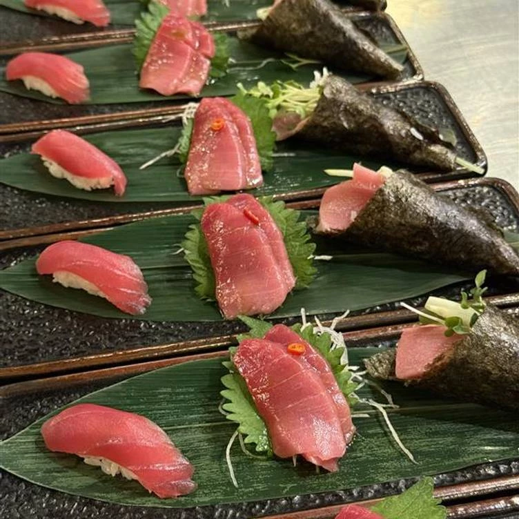 a row of sushi on a table