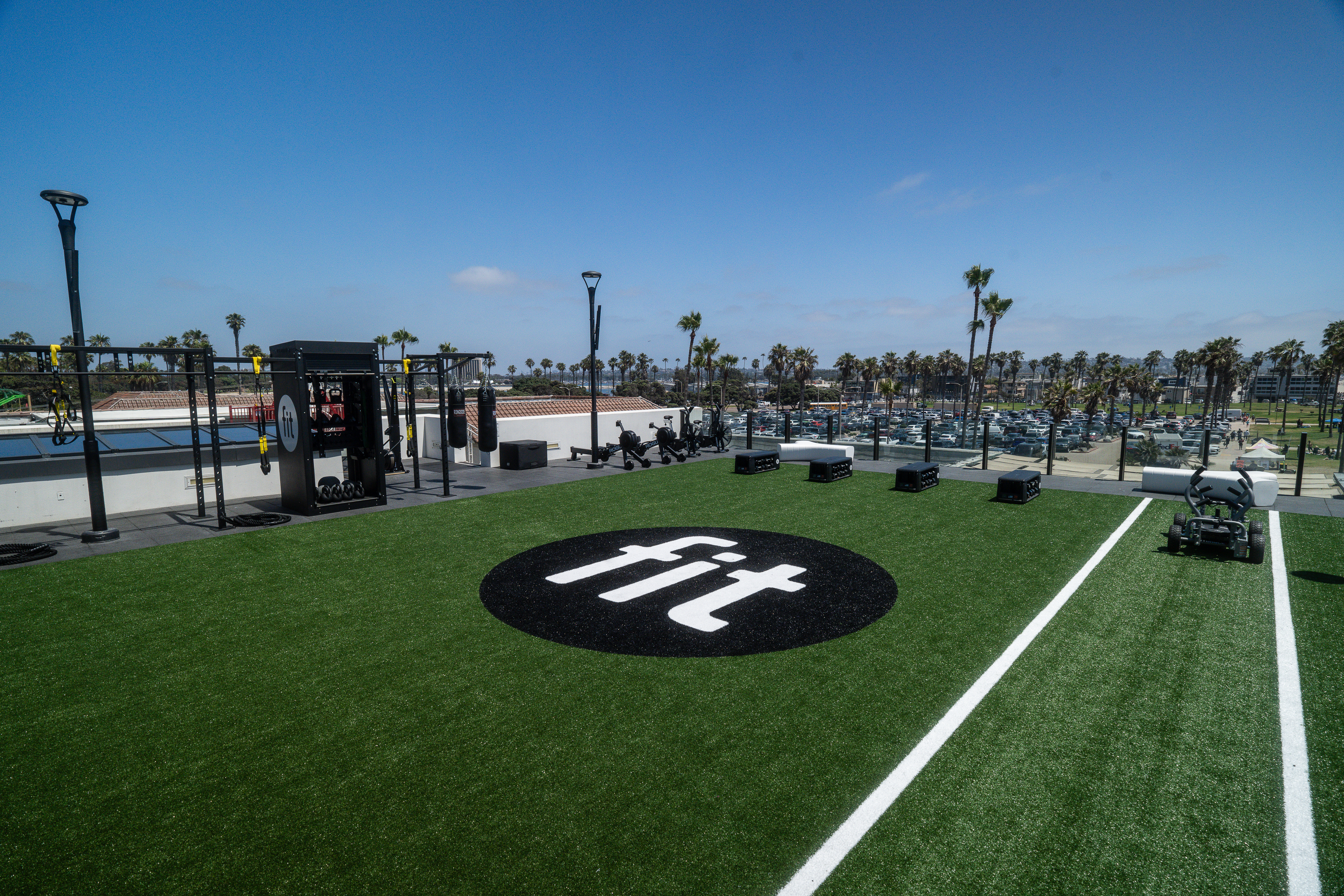 a building with a large building and a roller coaster