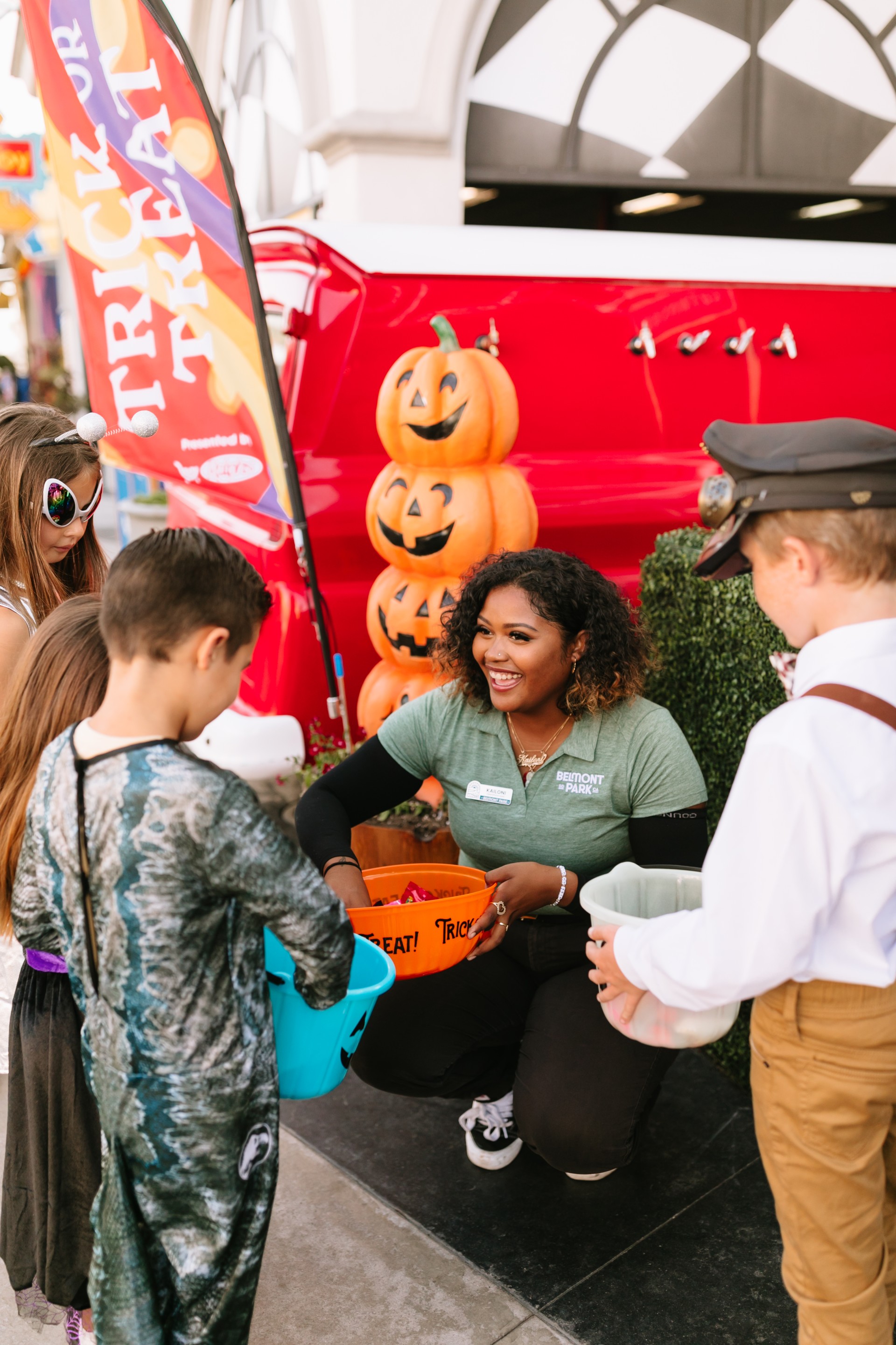 a woman holding buckets of candy
