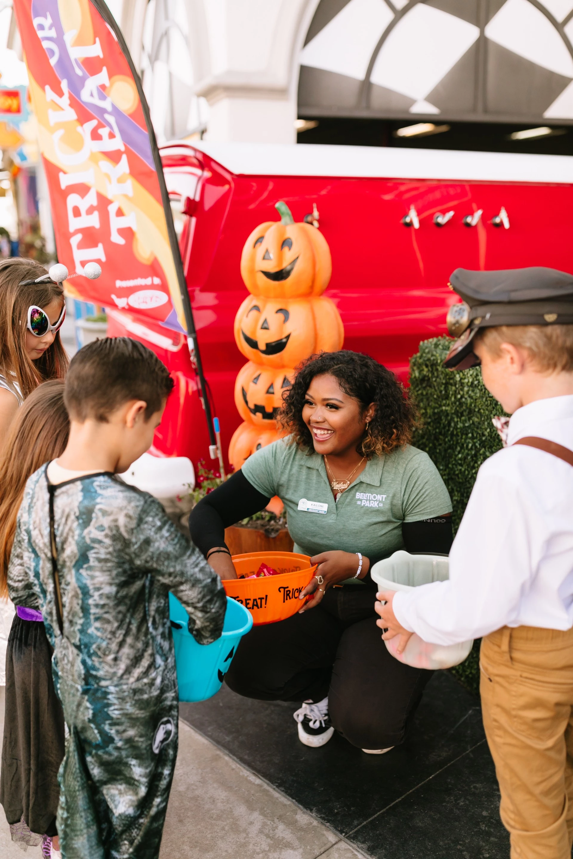 a woman holding buckets of candy