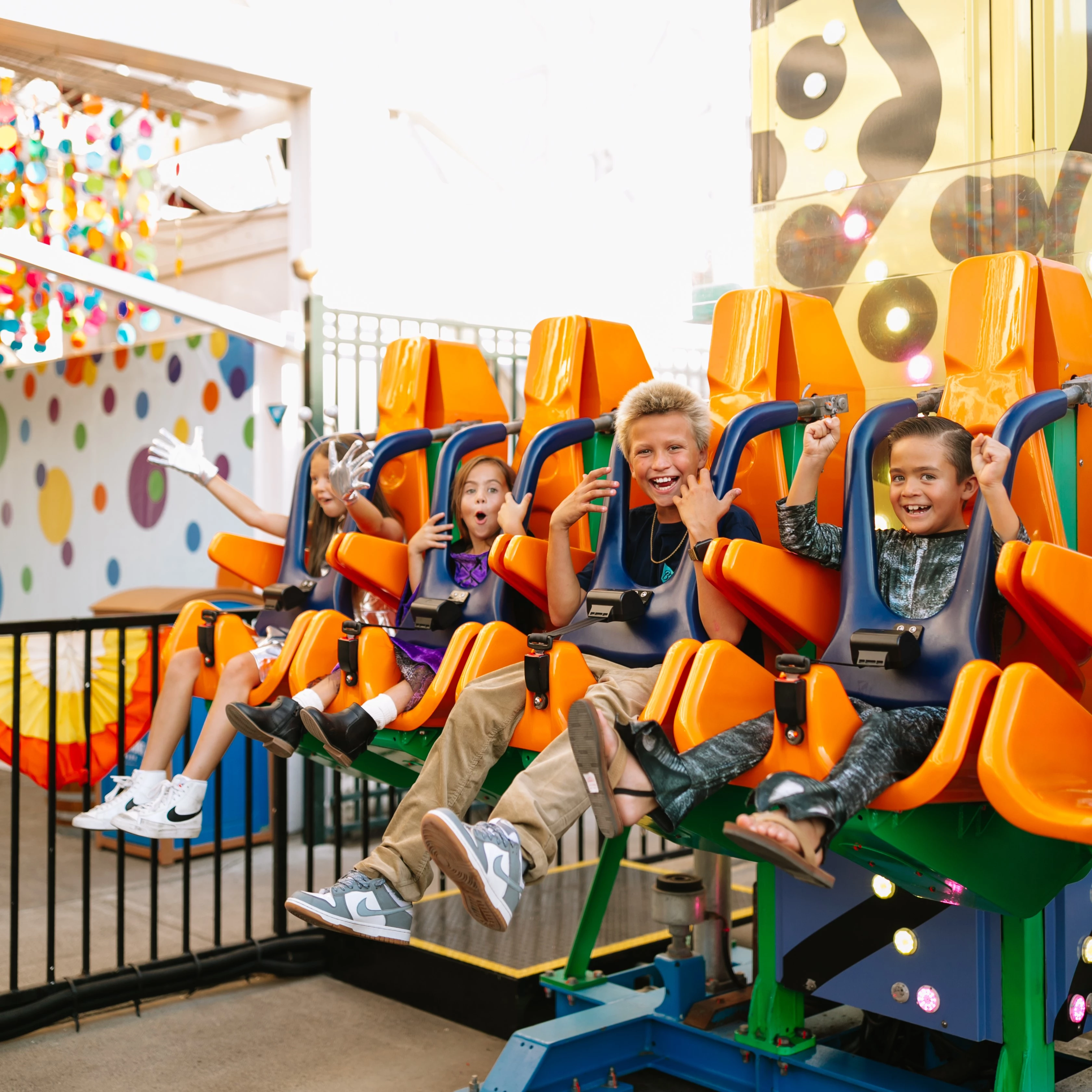 a group of kids on a roller coaster