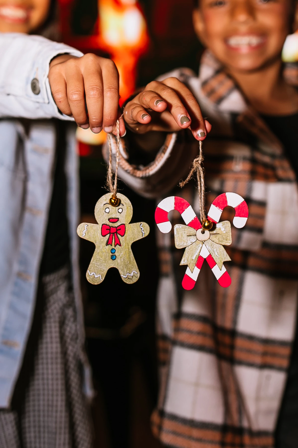 a person holding a couple of ornaments