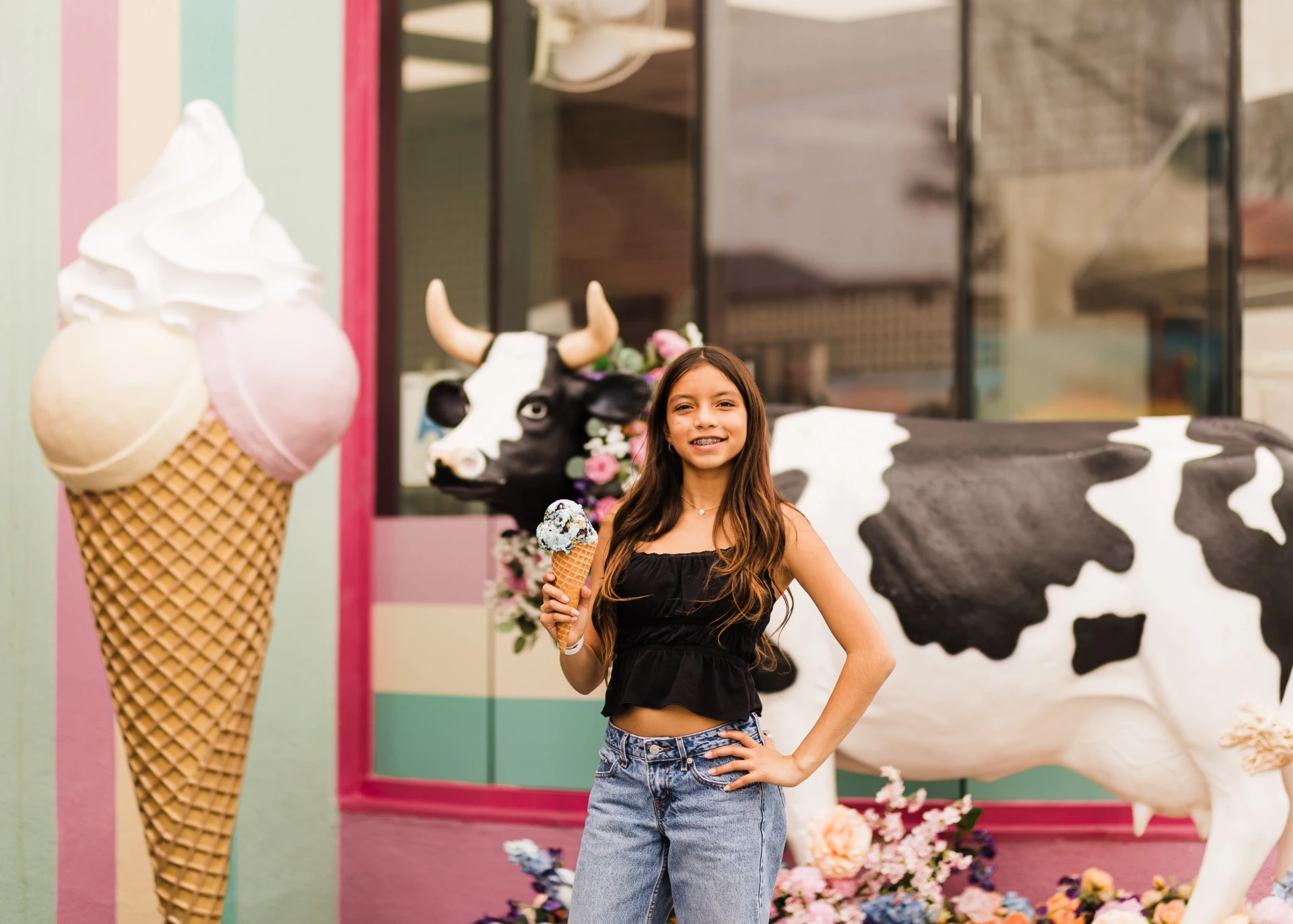 a girl holding an ice cream cone