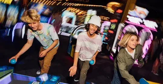 a group of people playing bowling