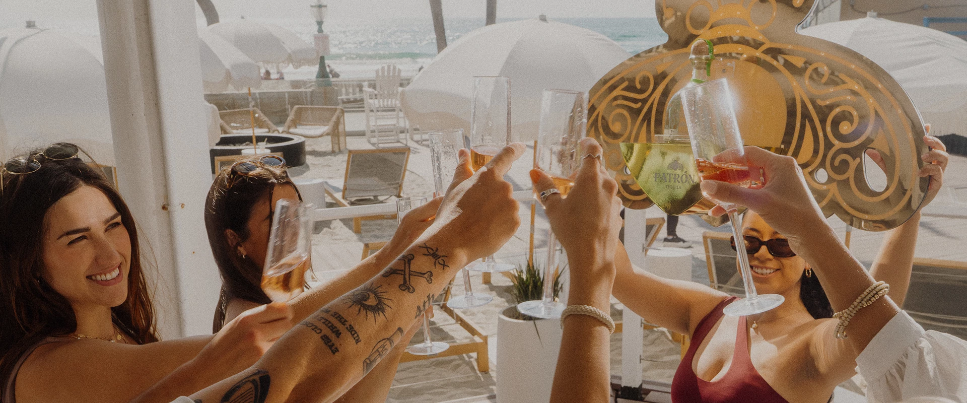 a group of people holding glasses of wine