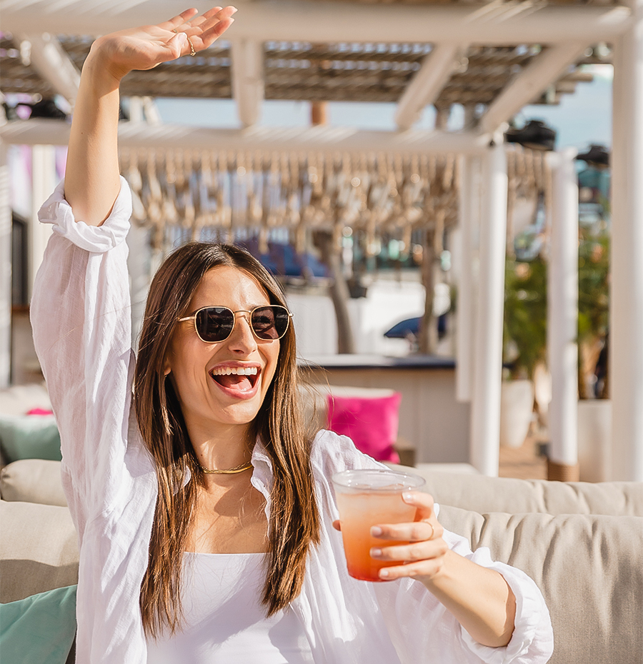 a woman holding a glass of wine