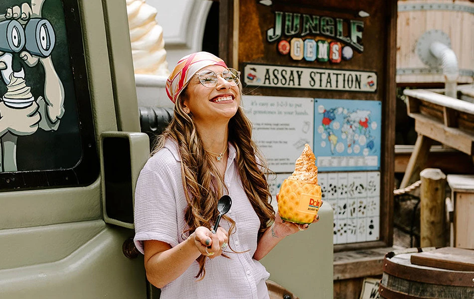 a woman holding a pastry